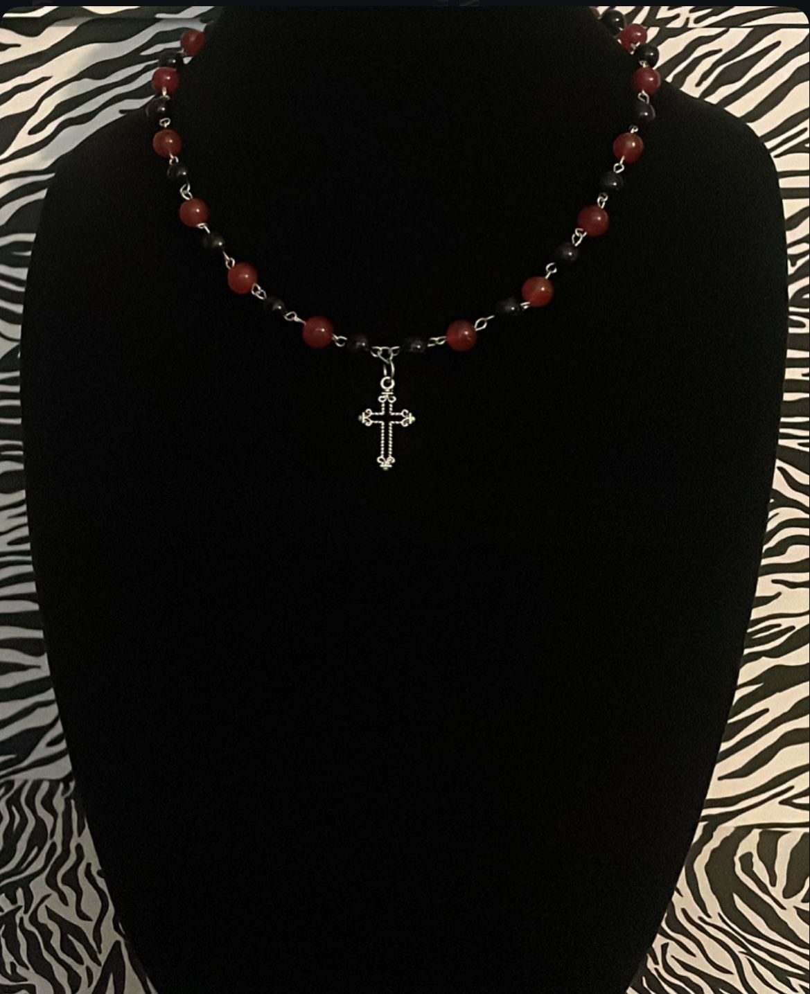 black and red beaded cross